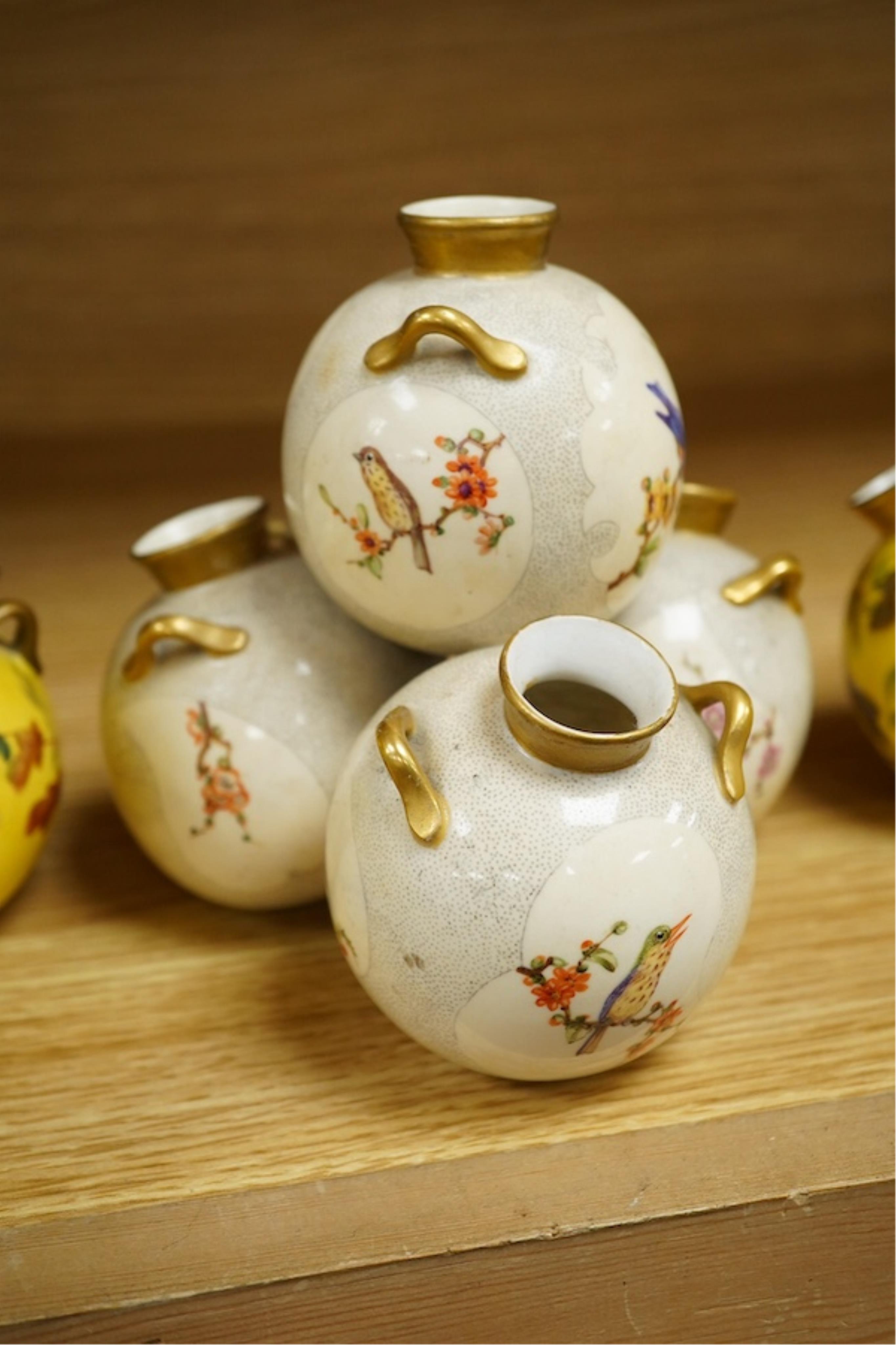 Three Royal Worcester 'pyramid' vases, painted with birds, 14cm high. Condition - fair/good